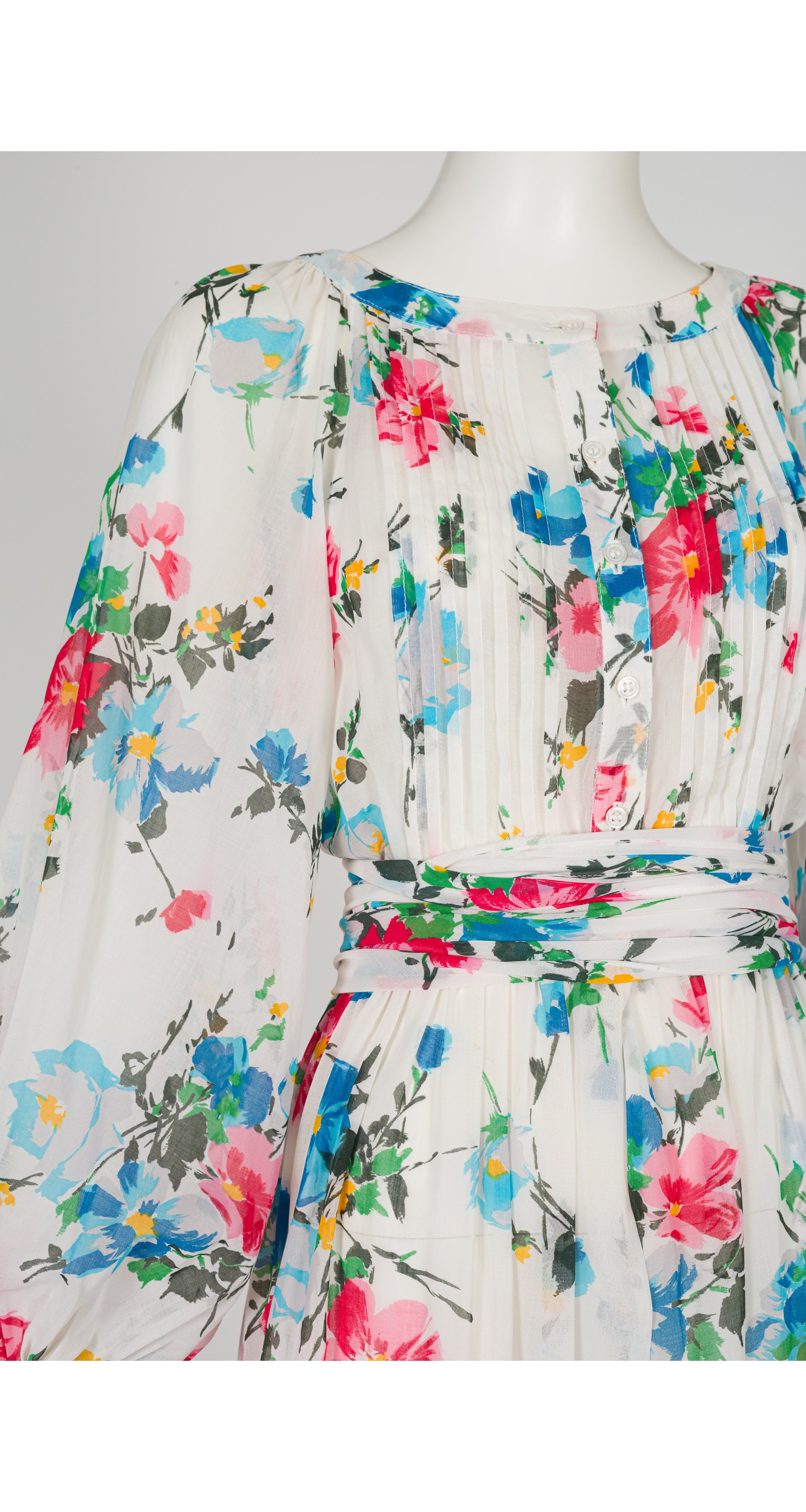 Close up 1970s Albert Nipon Floral White Cotton Vintage Dress on Mannequin