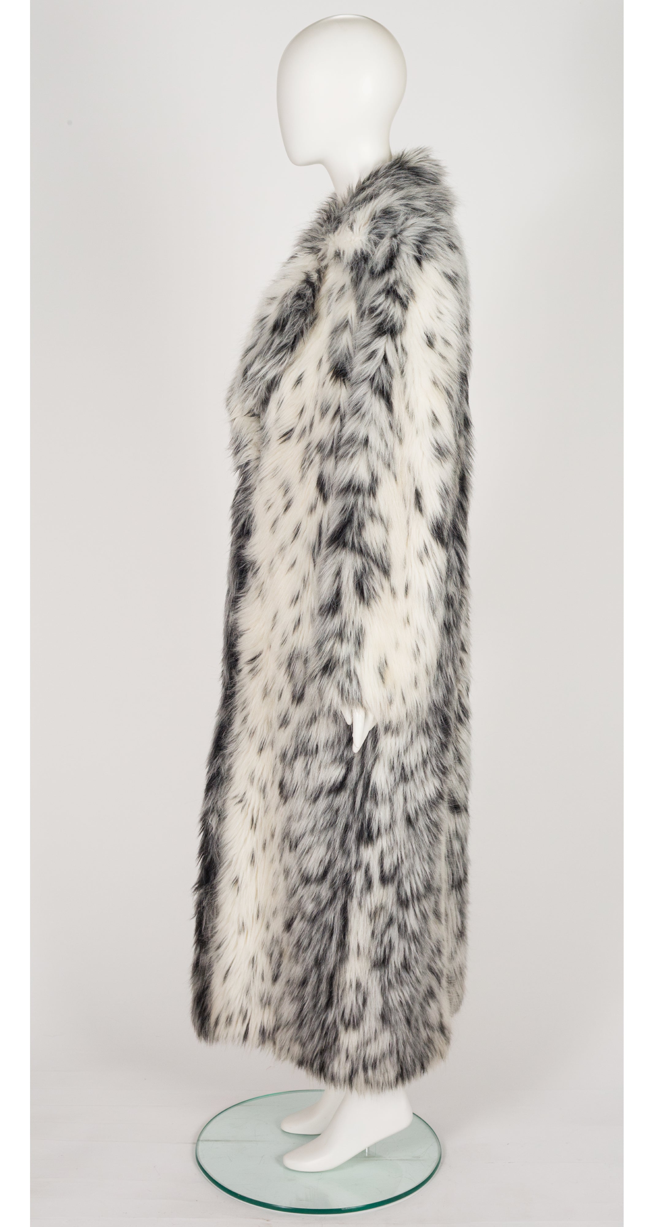 side of 1970s faux lynx fur full-length coat on mannequin