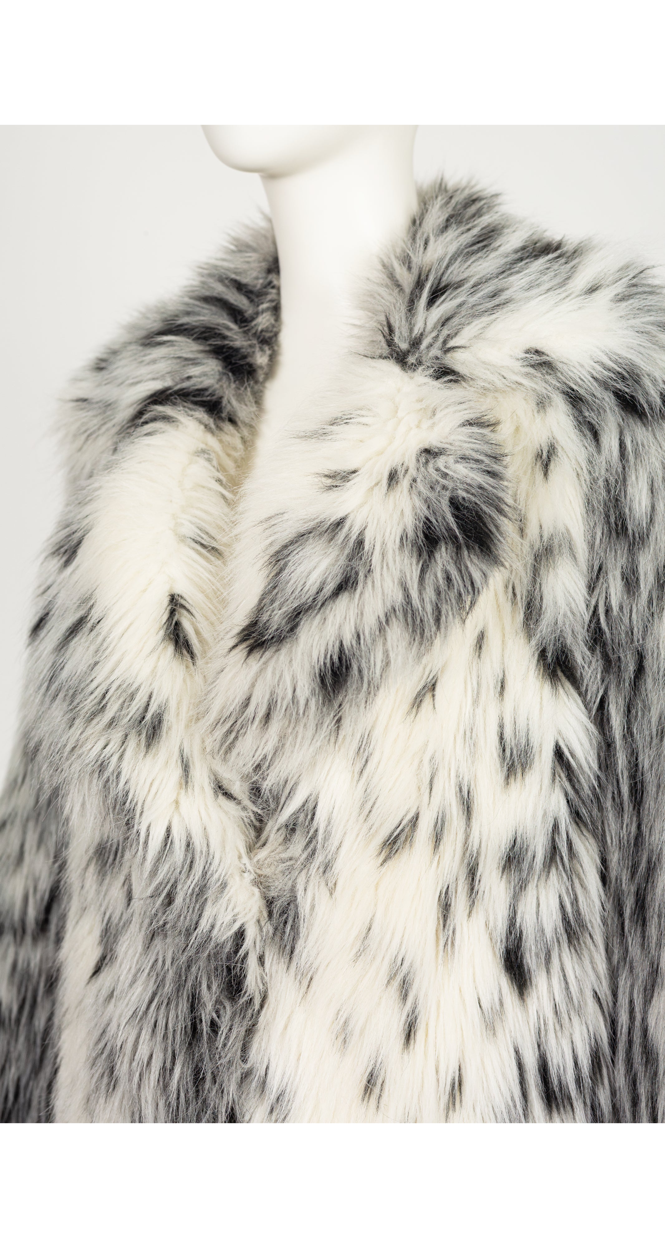 close-up of 1970s faux lynx fur full-length coat on mannequin