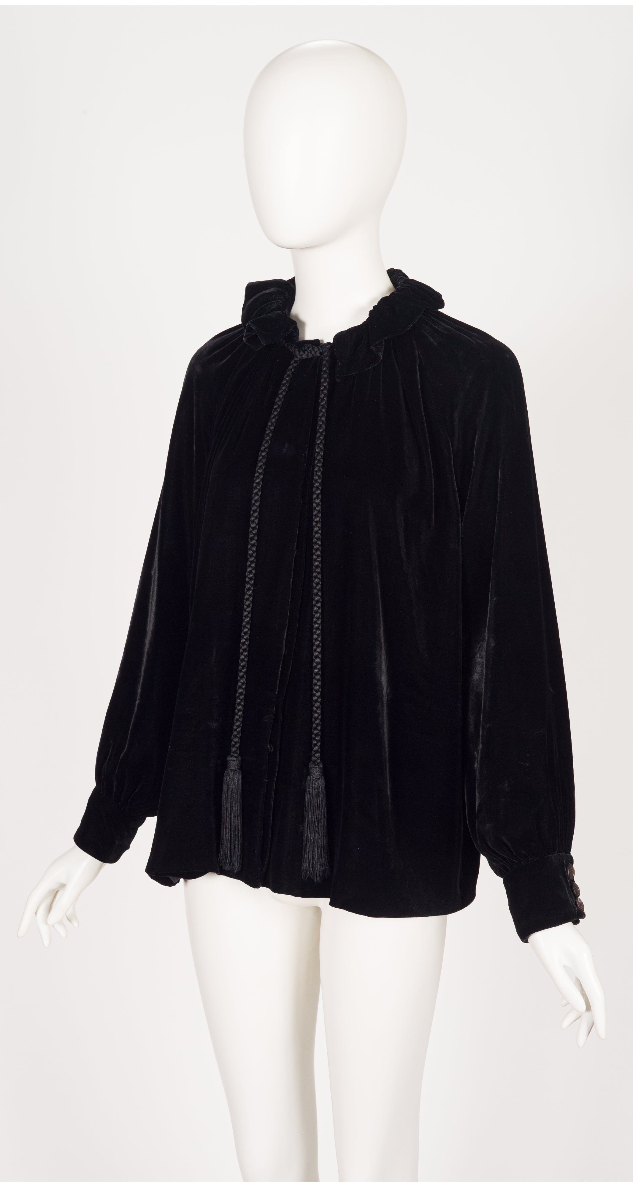 3/4 shot of 2012 Gucci black velvet tassel blouse on mannequin
