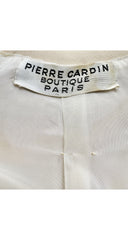 Label photo of 1969 Pierre Cardin cream wool coat on mannequin 