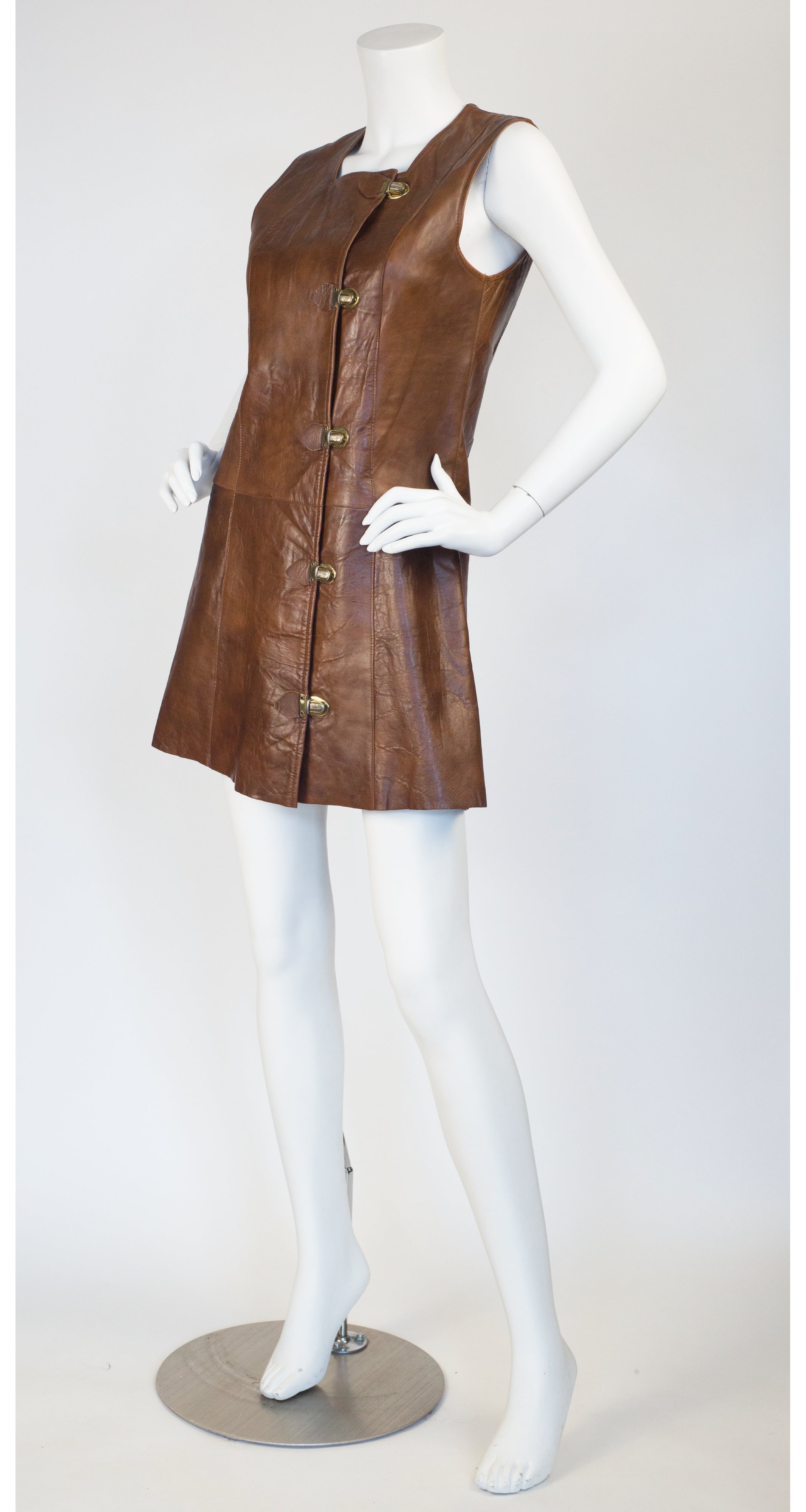 The Phyllis Look 1960s Vintage Mod Brown Leather Mini Dress Featherstone Vintage The Phyllis Look 1960s Vintage Mod Brown Leather Mini Dress Featherstone Vintage
